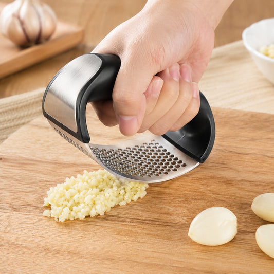Handheld stainless steel garlic press